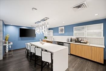 Club room kitchen and gathering space at sky on main